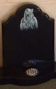 Polished black granite headstone with inlay Polished black granite headstone with inlay